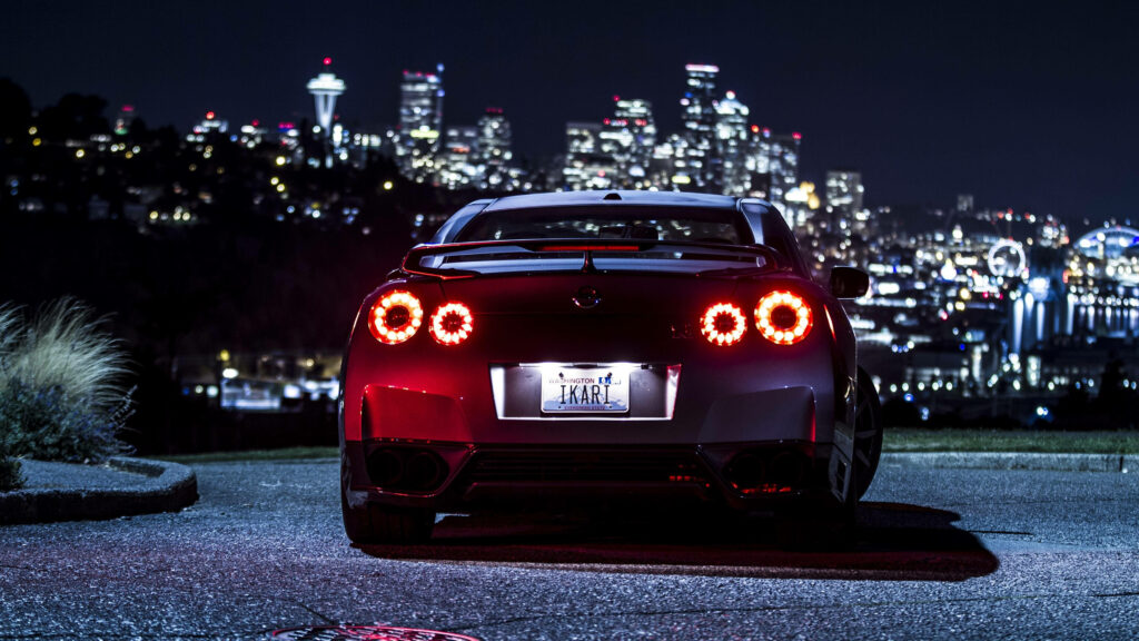 Midnight Rush: Blue Nissan GTR Car Heading to the City Wallpaper