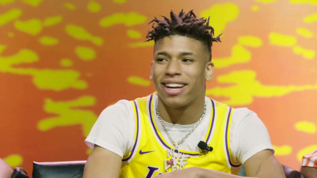 Lakers Swagger: Nle Choppa Shows off Signature Style in Front of Backdrop Wallpaper