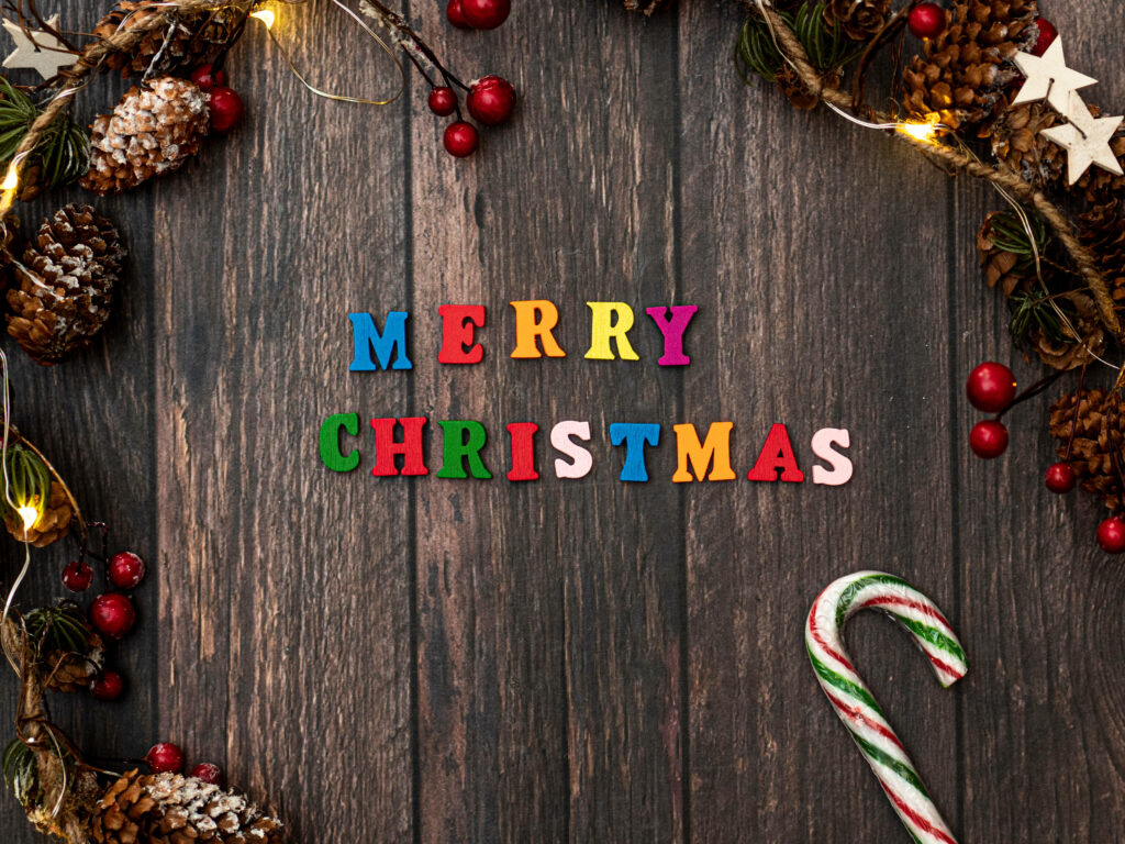 Whimsical Woodland Christmas Greetings: Festive Colors Meet Rustic Charm Wallpaper