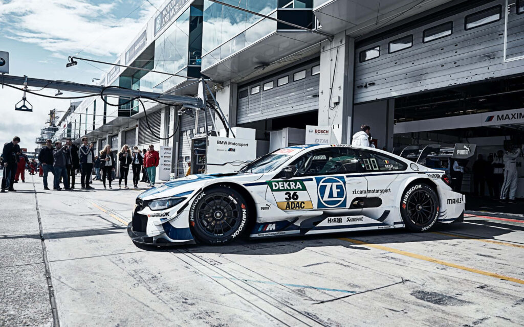 High Resolution Snapshot of the BMW M4 DTM in a Striking White Racing Edition - Perfect Wallpaper for BMW M Series Fans!