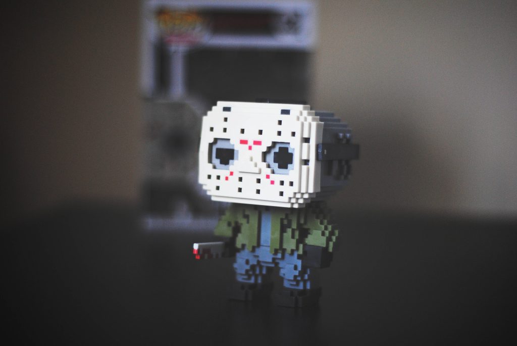 8-bit Jason Voorhees Funko Pop with pixelated hockey mask and machete retro horror figure Wallpaper