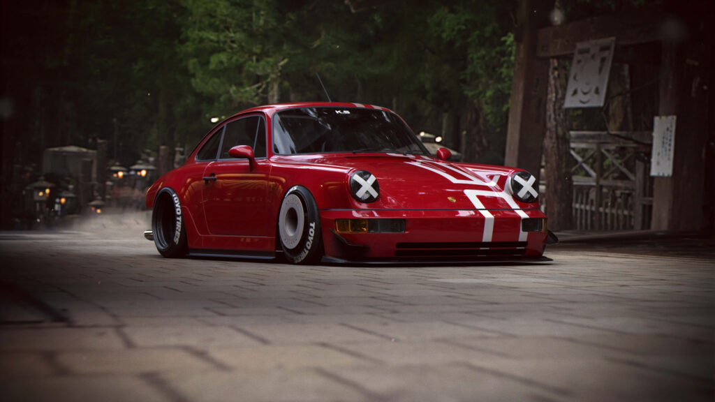 Red Porsche 911 rally car with decals in green forest and rustic building 8k wallpaper background
