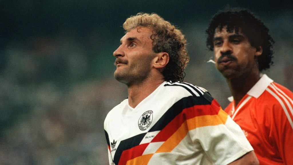Vintage 90s football rivalry West German striker Rudi Völler and Dutch legend Frank Rijkaard action shot Wallpaper