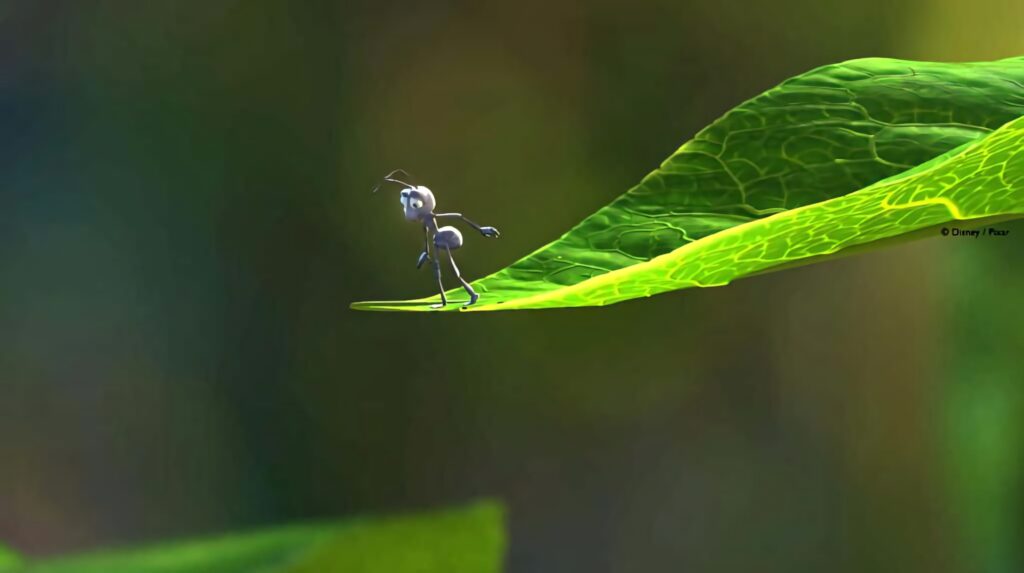 Animated ant on bright green leaf with blurred nature background A Bugs Life wallpaper