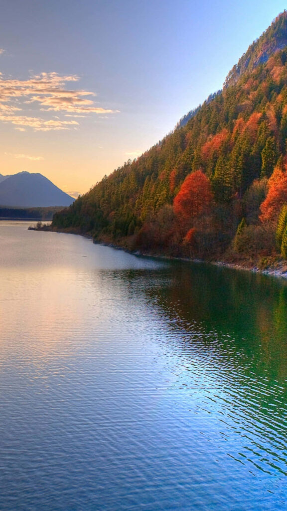 Nature's Splendor: Vibrant Autumn Colors Adorning a Majestic Mountain by a Serene River - Iphone 6 Plus Lock Screen Delight Wallpaper