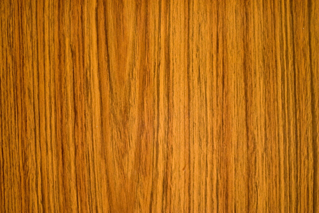 Enchanting Teak Wood Texture: Dark Brown Hue with Abstract Vertical Patterns - Captivating Wood Texture Background Wallpaper