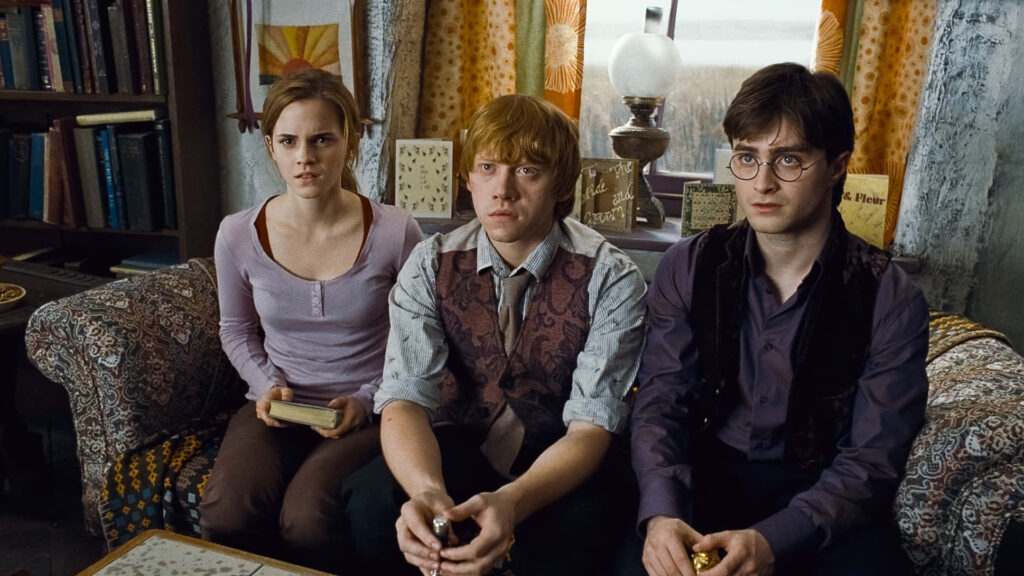 Cozying Up with Harry, Ron, and Hermione: A Magical Landscape Wallpaper