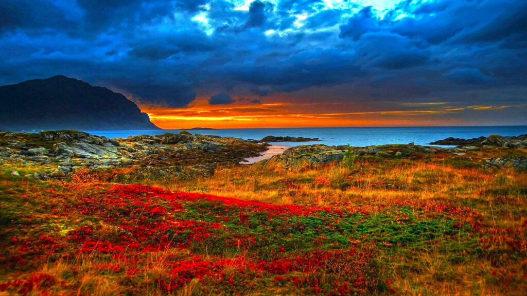 Vibrant Coastal Scenery: Majestic Mountain and Colorful Rocky Seashore in Stunning HD Wallpaper