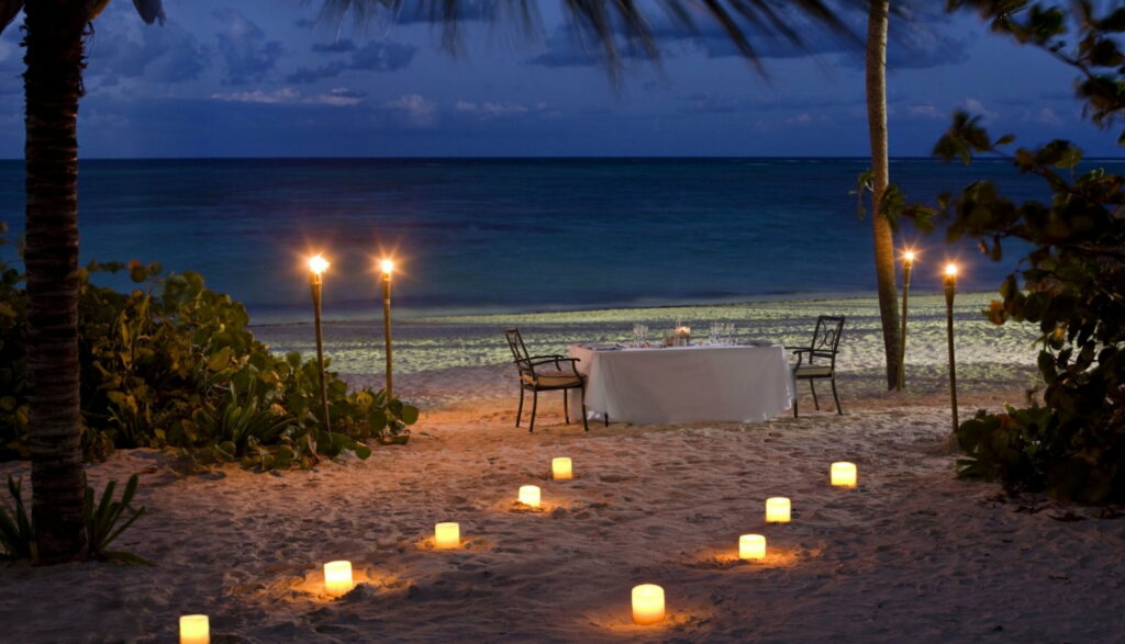 Serenity by the Sea: A Captivating Evening of Romance and Candlelit Dinner Wallpaper