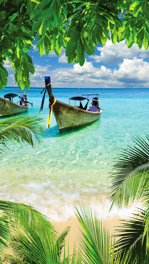 Serene Paradise: A Captivating Tropical Island Escape with a Tranquil Boat Drifting Amidst Breathtaking Scenery Wallpaper