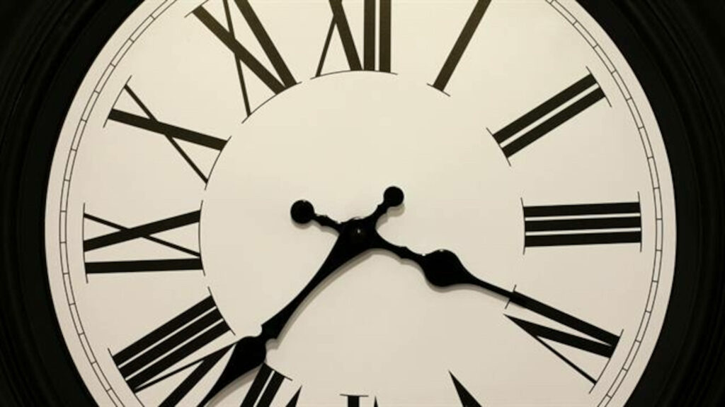 Timeless Elegance: A Classic Roman Numeral Clock Wallpaper