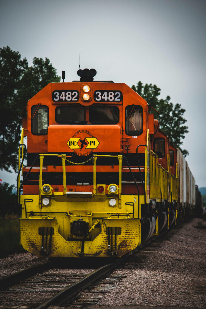 All Aboard the Nostalgic Journey: Reliving Childhood Memories through the Vibrant Train at the Station Wallpaper
