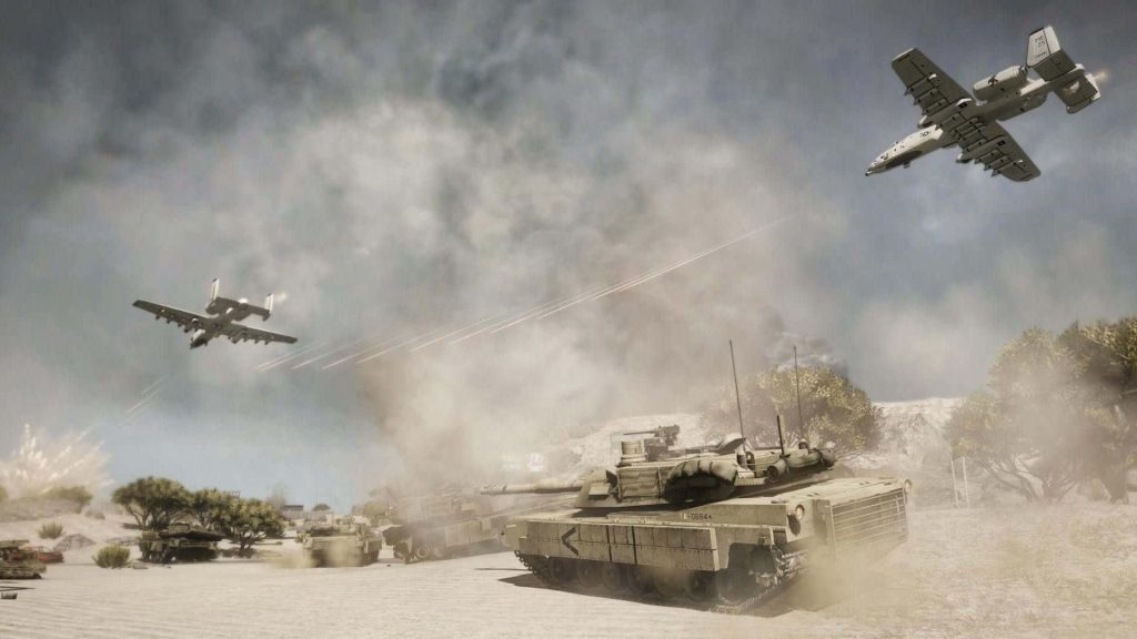 A-10 Warthog aircraft firing tracers over desert battlefield with M1 Abrams tanks in combat Wallpaper