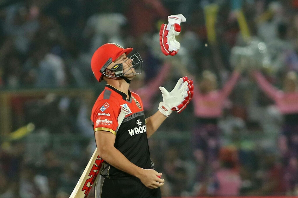 AB de Villiers in RCB jersey tossing gloves IPL 2020 dynamic cricket moment wallpaper background