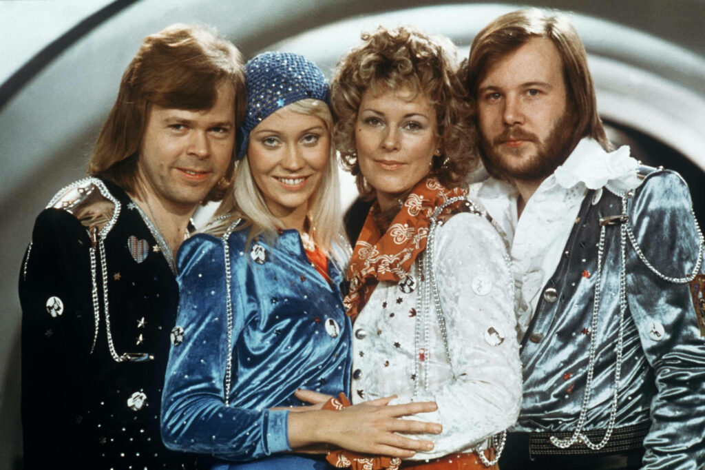 ABBA Eurovision 1974 colorful performance outfits energetic legendary music group wallpaper