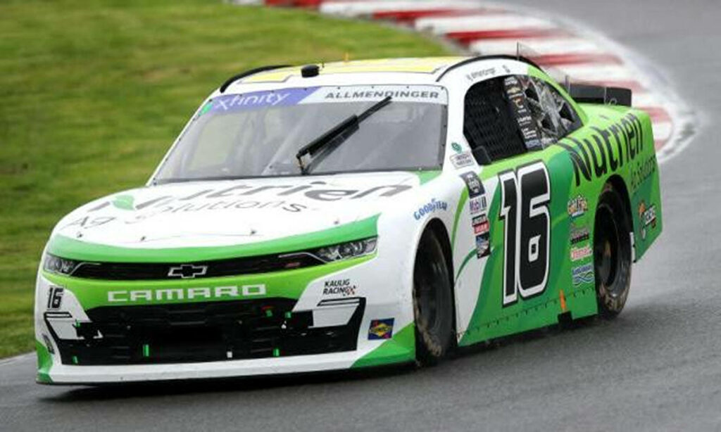 AJ Allmendinger race car number 16 with Nutrien Ag Solutions on wet track racing action wallpaper