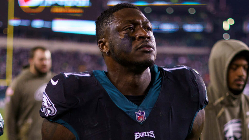 A J Brown in Philadelphia Eagles uniform with intense expression on field wallpaper background