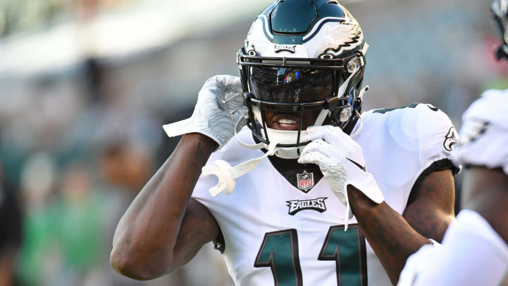 AJ Brown Philadelphia Eagles uniform focused removing helmet football field wallpaper background
