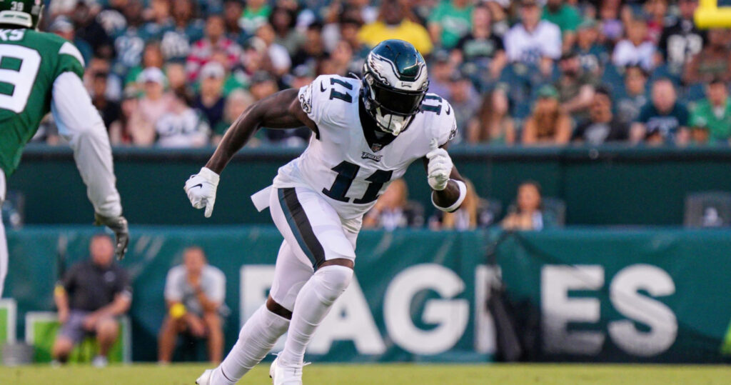 AJ Brown sprinting down field showcasing athleticism and focus in dynamic football wallpaper