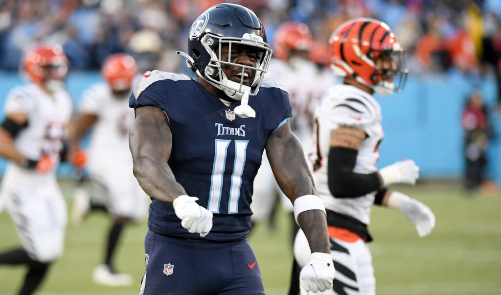 AJ Brown Tennessee Titans celebrating passionately on field during intense football game action Wallpaper