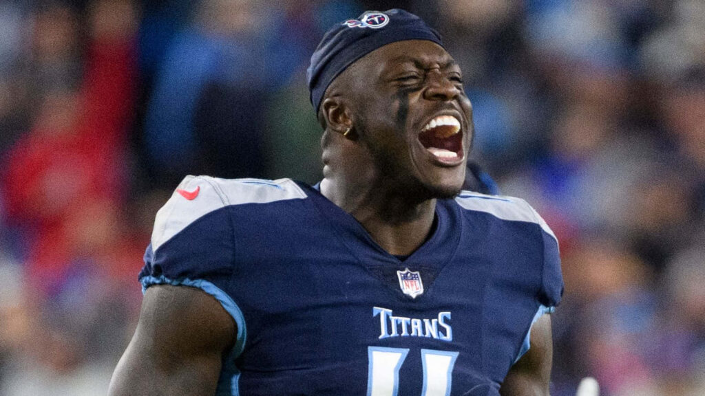 A J Brown Tennessee Titans celebrating passionately on field showing intense energy and determination Wallpaper