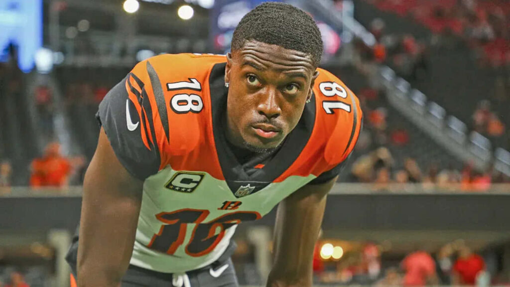 A J Green focused on field in Cincinnati Bengals uniform showcasing dedication and athleticism wallpaper