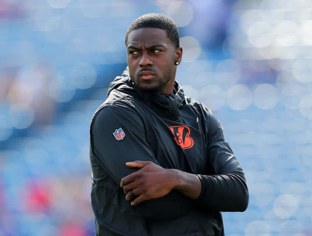 AJ Green focused in Cincinnati Bengals gear during pregame warmup with intense mindset wallpaper