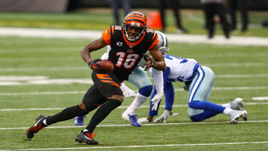 A.J. Green evades defender displaying athleticism in dynamic football action wallpaper background
