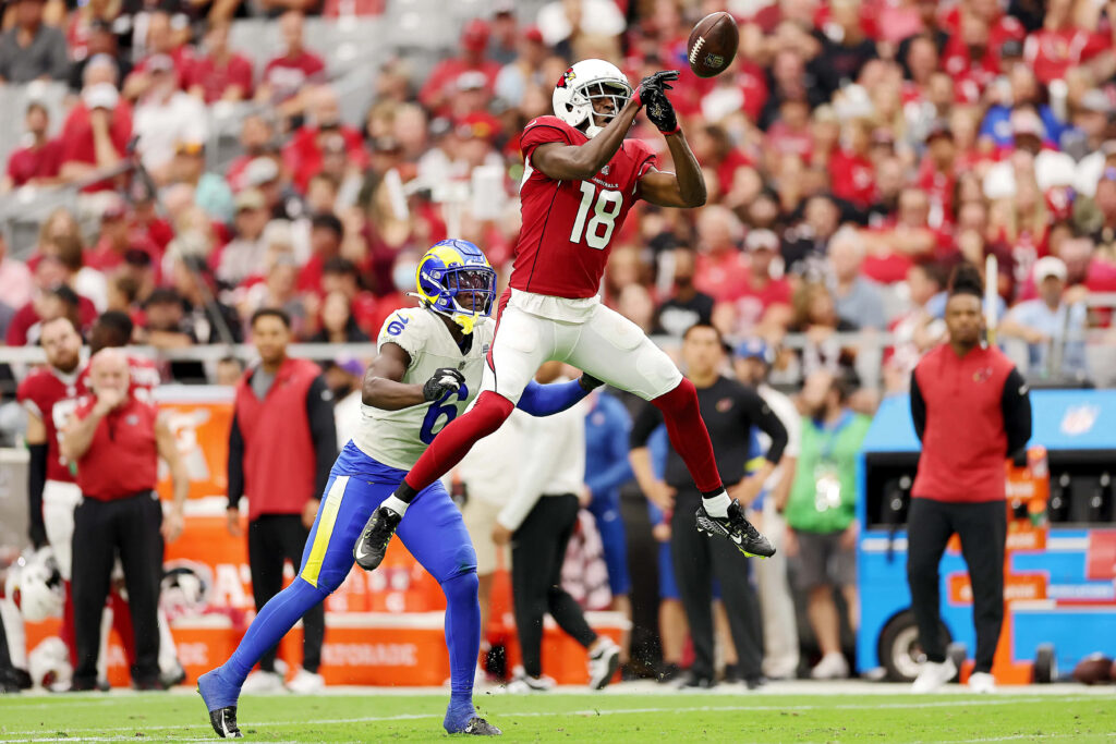 AJ Green leaps high catching football showcasing athleticism focus intense game action wallpaper