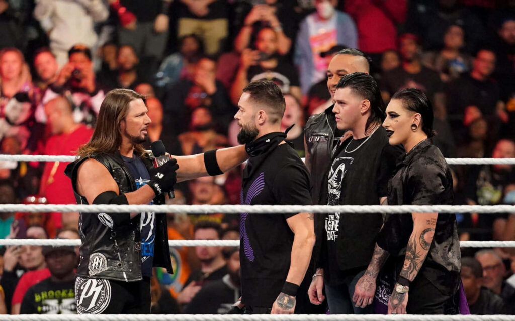 AJ Styles faces The Judgment Day superstars in WWE Raw ring intense showdown wallpaper background