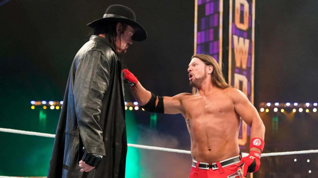 AJ Styles confronts The Undertaker WWE intense showdown dynamic wrestling wallpaper background