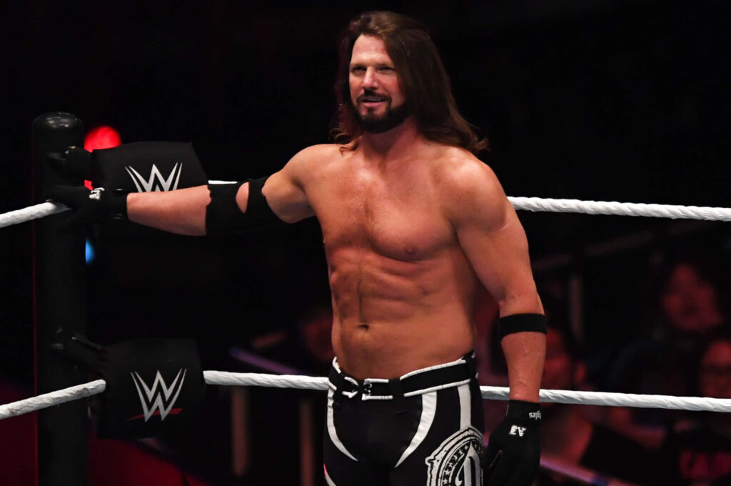 AJ Styles in WWE Smackdown ring showing athletic physique and signature wrestling gear wallpaper
