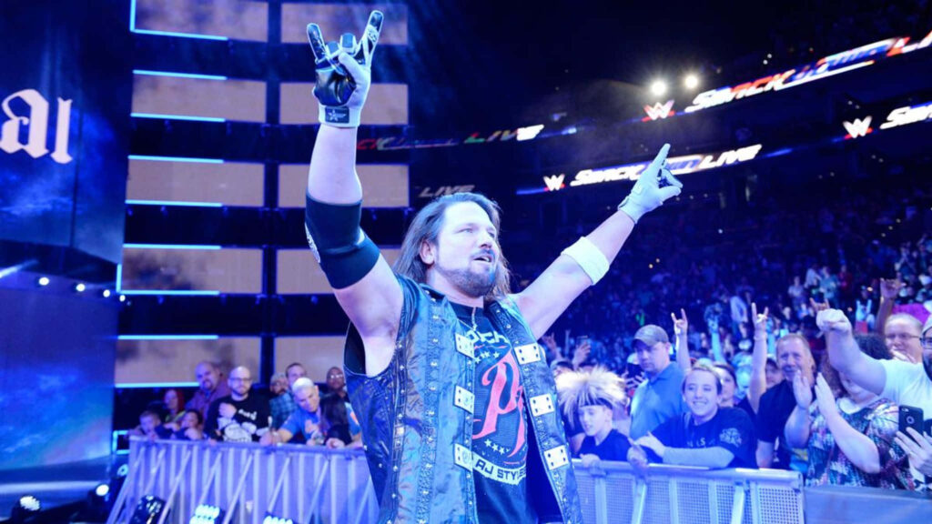 AJ Styles celebrating WrestleMania 33 victory in ring with cheering crowd and energetic atmosphere Wallpaper