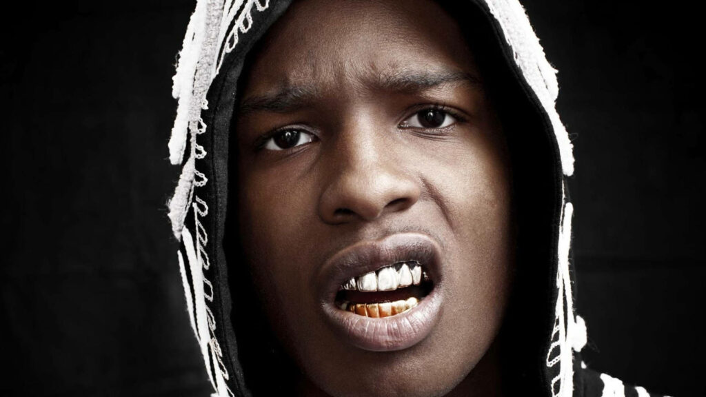 A$AP Rocky fierce expression with signature grill in hooded jacket dark edgy high-resolution wallpaper