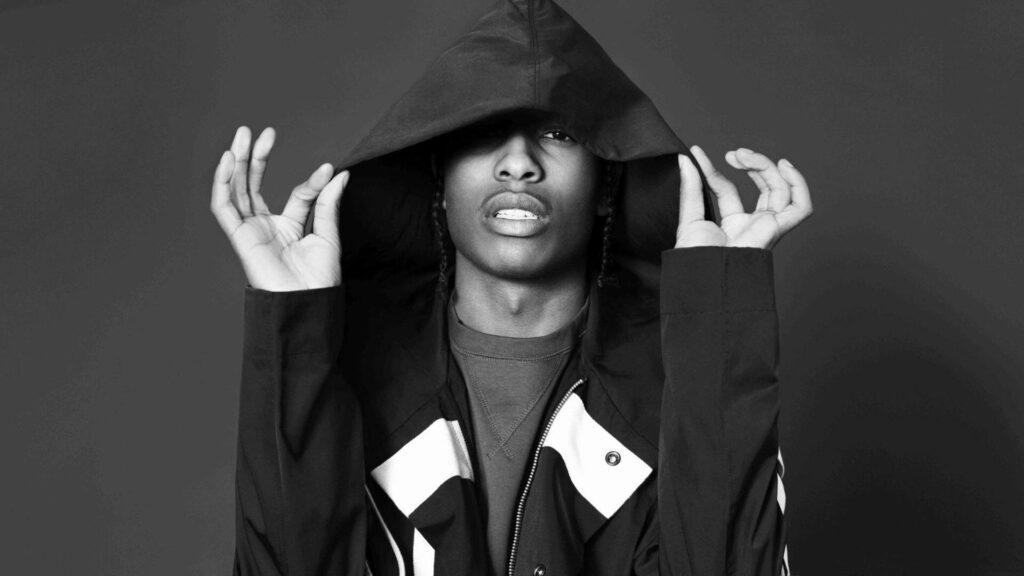 A$AP Rocky in stylish hoodie on black and white background bold modern rapper wallpaper