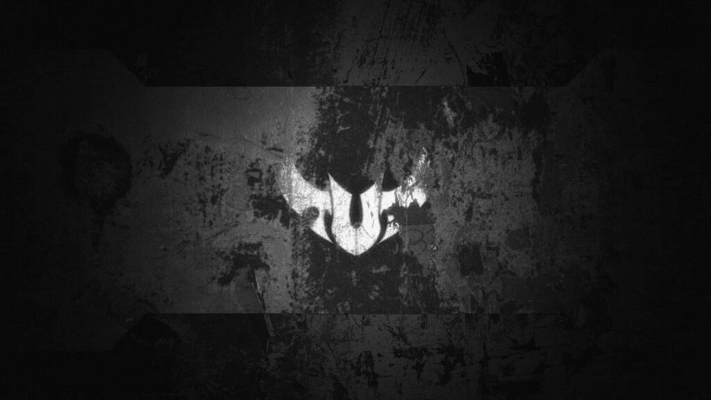 ASUS TUF Gaming wallpaper with bold TUF logo on distressed textured dark rugged background