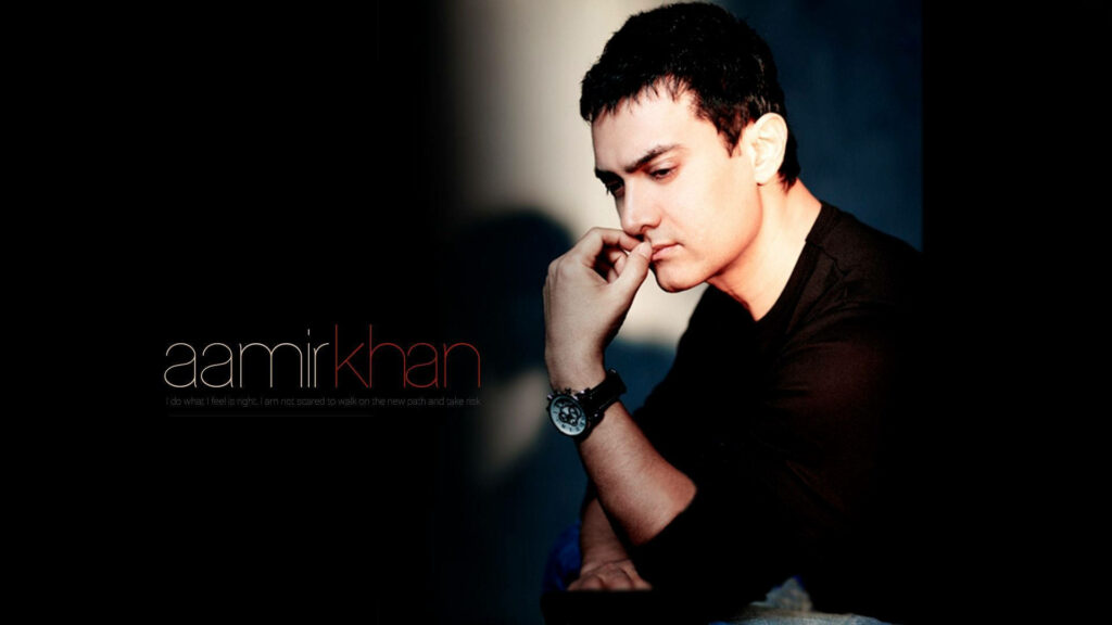 Aamir Khan contemplative portrait with soft lighting on dark background striking wallpaper image