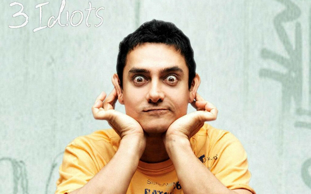 Aamir Khan playful pose Three Idiots movie iconic character humorous expression wallpaper