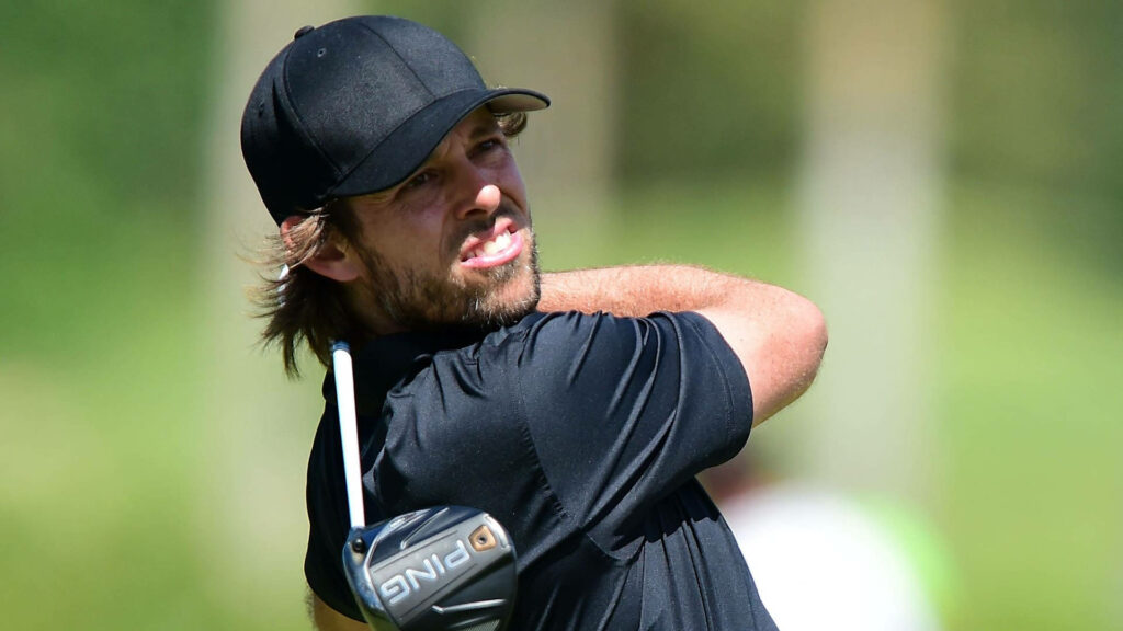 Aaron Baddeley focused after powerful golf drive celebrating Greg Norman Holden International win Wallpaper