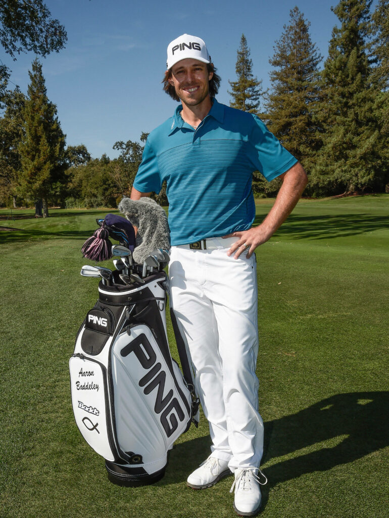 Aaron Baddeley smiling on lush golf course with personalized PING golf bag professional wallpaper
