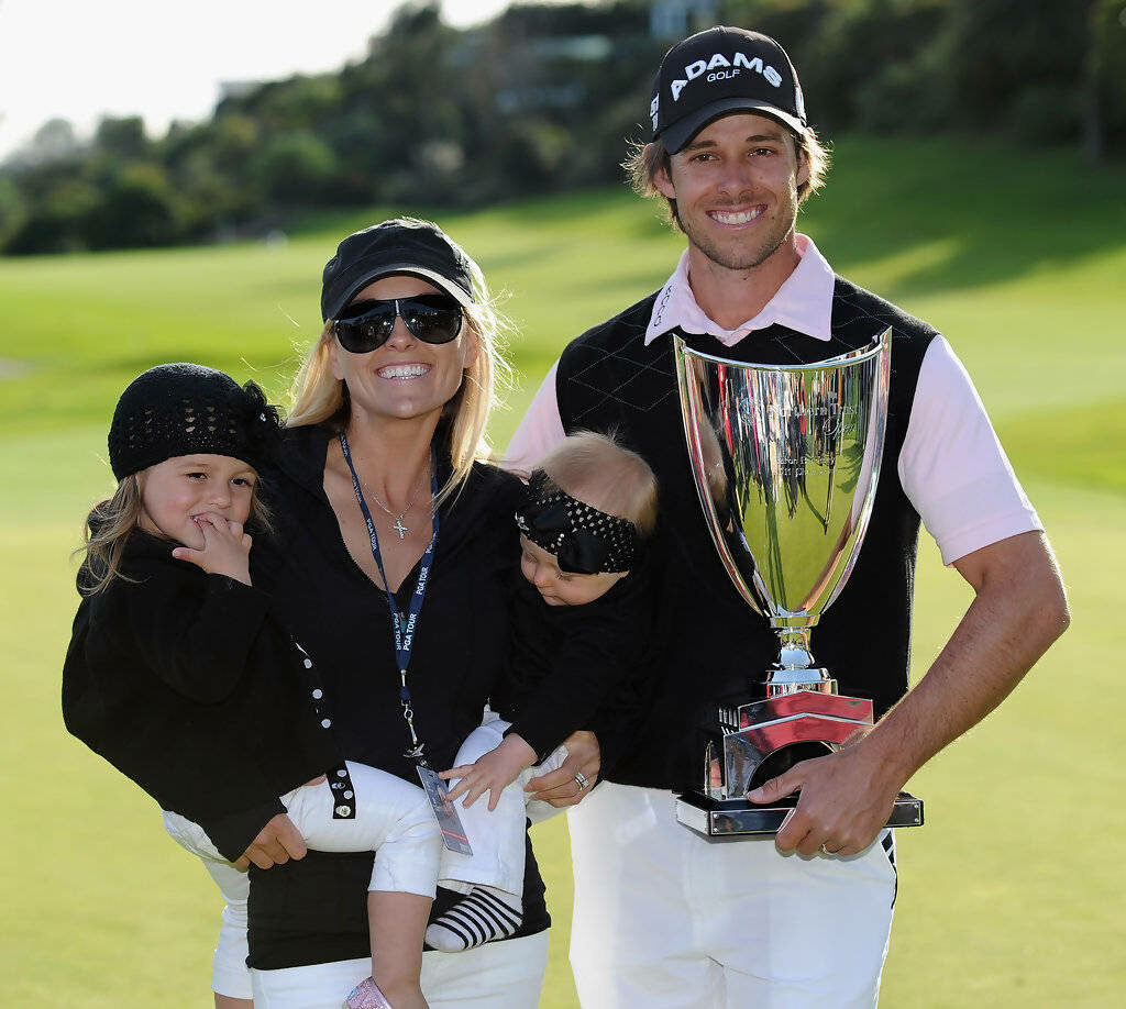 Aaron Baddeley celebrates golf trophy win with smiling family on golf course victory wallpaper background