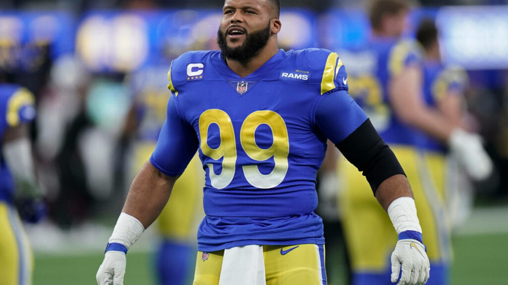 Aaron Donald in blue Los Angeles Rams jersey on field showing dominant NFL defensive power wallpaper