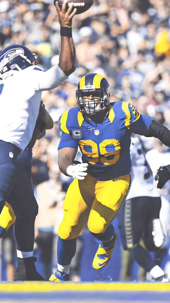 Aaron Donald Los Angeles Rams intense action football game vibrant candid wallpaper background