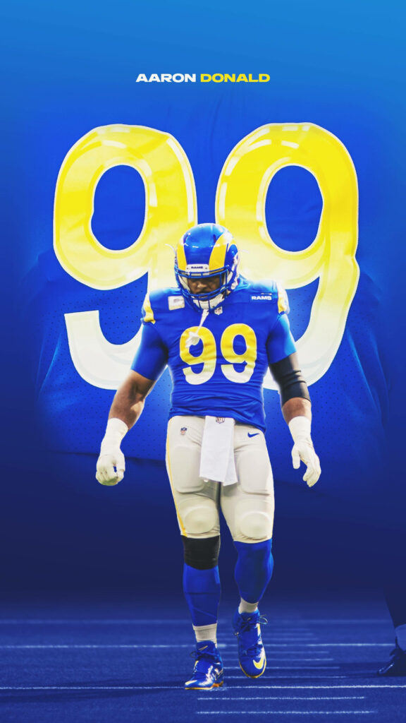 Aaron Donald in Los Angeles Rams jersey number 99 with vibrant blue and yellow NFL wallpaper background