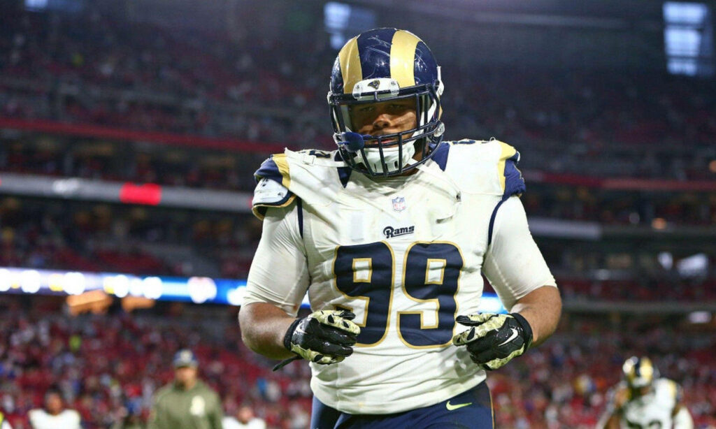 Aaron Donald in Los Angeles Rams uniform showcasing rookie season intensity on the football field Wallpaper
