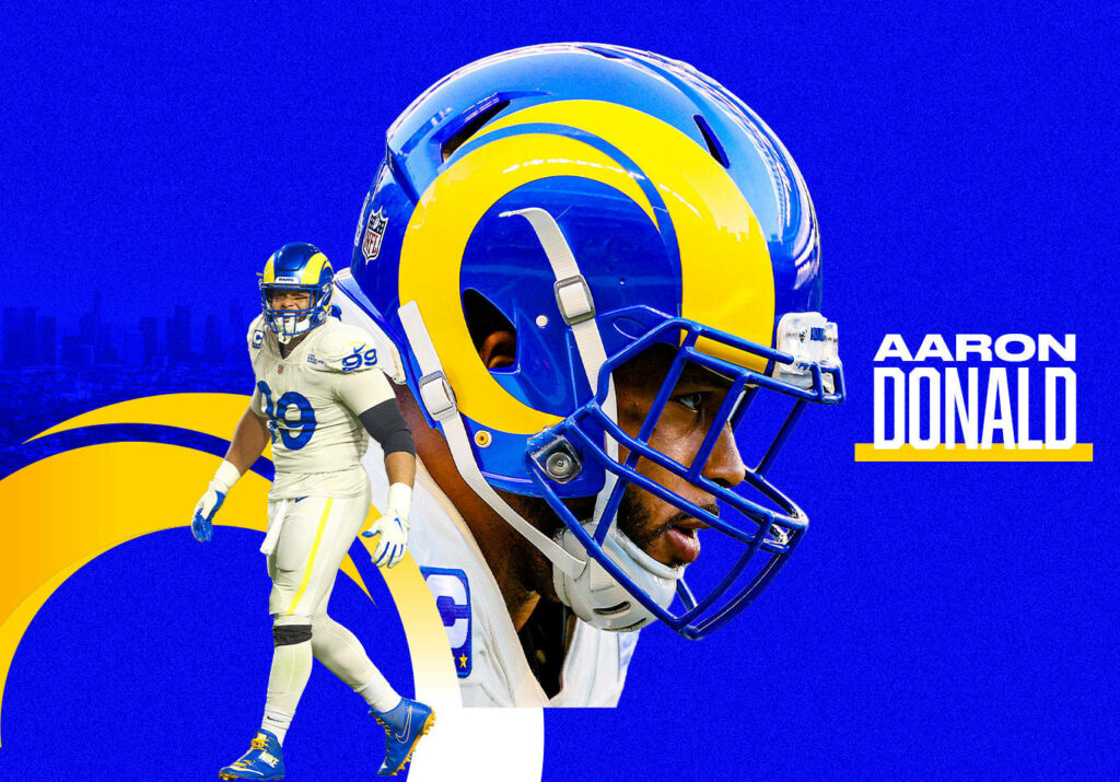 Aaron Donald in Los Angeles Rams uniform on dynamic blue and yellow NFL wallpaper background