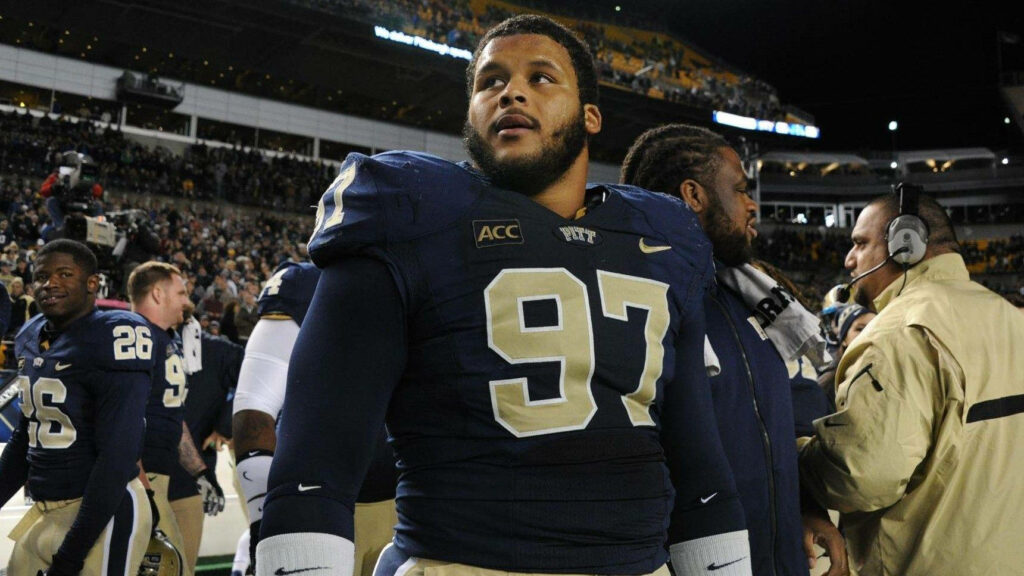 Aaron Donald NFL football candid sideline photo showing focus and determination in uniform Wallpaper