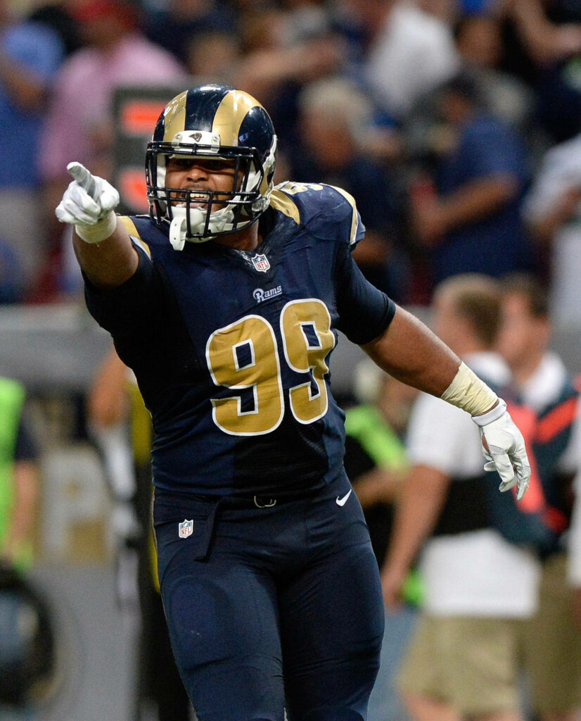 Aaron Donald in St Louis Rams jersey celebrating on field showing intensity and power wallpaper