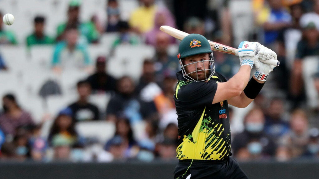 Aaron Finch Australia cricket captain playing powerful shot dynamic sports wallpaper background