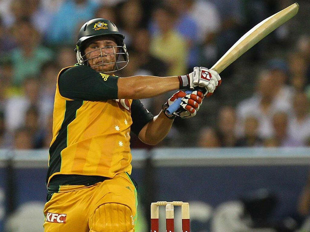 Aaron Finch Australian cricket player hitting powerful shot showing skill and determination Wallpaper
